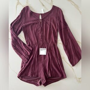 Size M burgundy long sleeve romper for sale. Good condition - never worn.